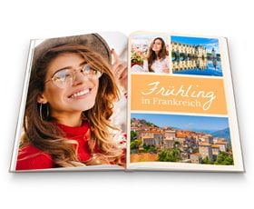 Offenes Buch mit Bildern und dem Titel "Frühling in Frankreich", lächelnde Frau mit Sonnenbrille auf der linken Seite.